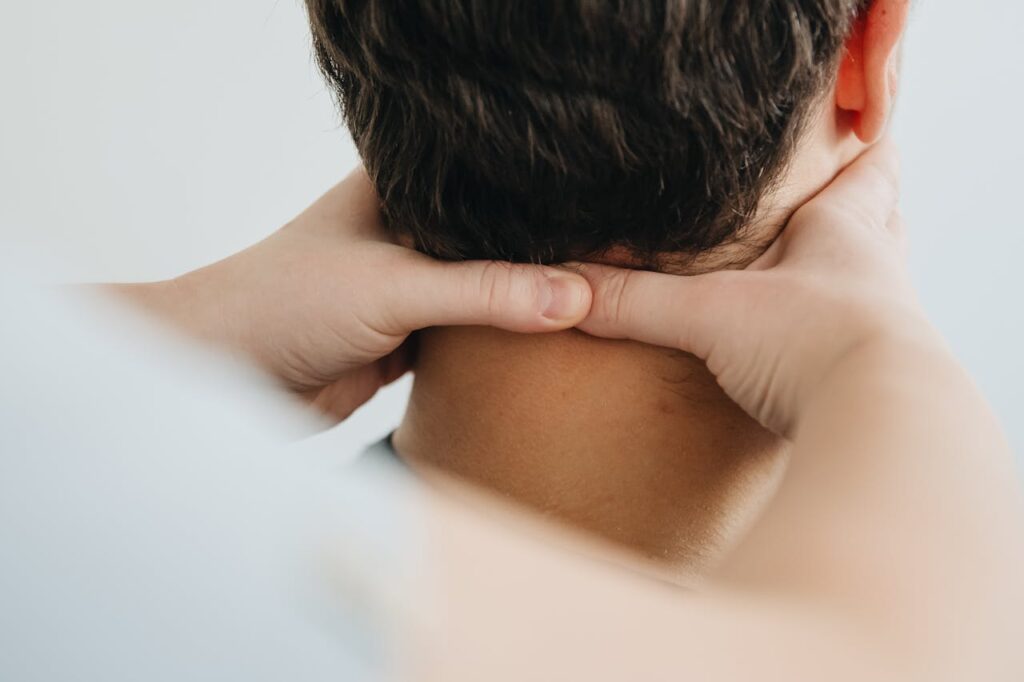 Physiotherapist Massaging Neck